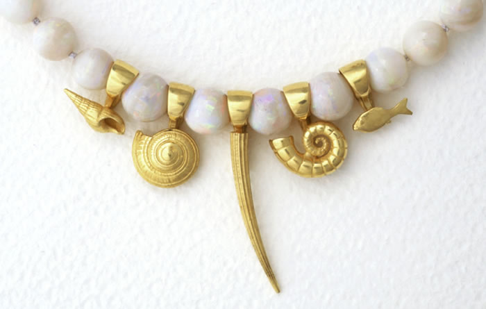 18k gold marine motifs on Opal spherical beads